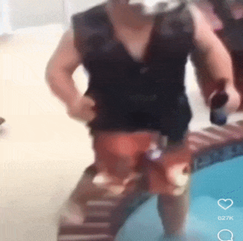 a blurry picture of a man standing in a pool
