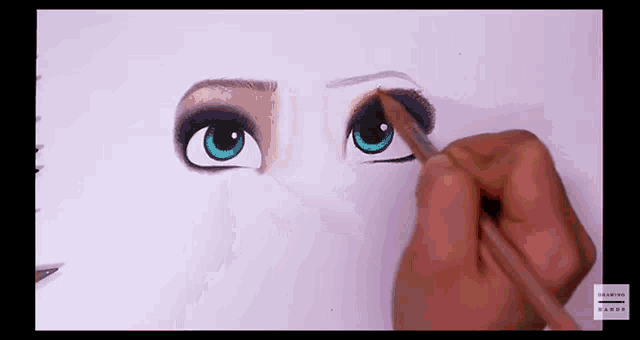 a person is drawing a woman 's eye with a pencil