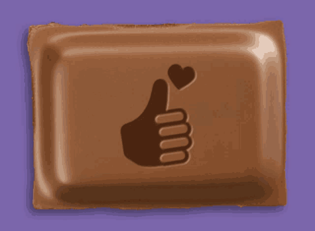 a chocolate bar with a thumbs up sign and a heart on it