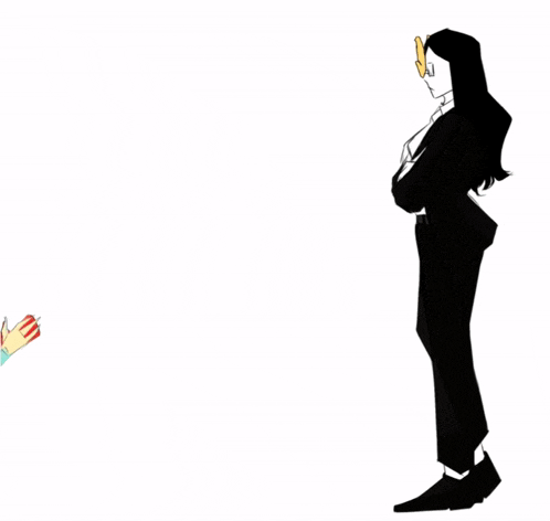 a man in a suit stands next to a woman kneeling on the ground