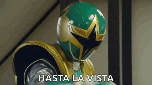 a green and gold power ranger is wearing a helmet that says hasta la vista .