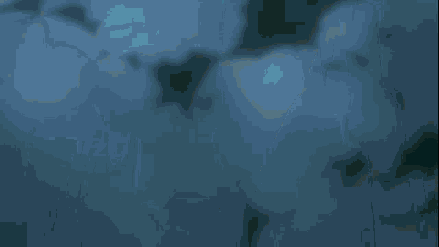 a pixelated image of a person 's torso with a green light behind them