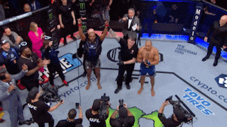 a fighter in a boxing ring with the word toyo tires on the ground