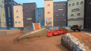 a hot wheels monster truck is going down a dirt track