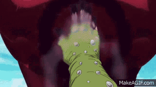 a green hand is sticking out of a large red mouth
