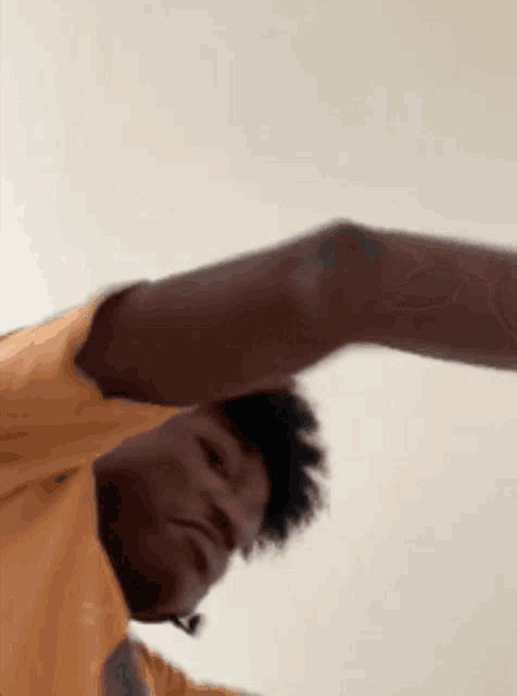 a close up of a man 's arm against a white background