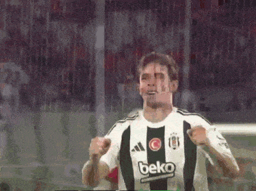 a soccer player wearing a beko shirt celebrates a goal
