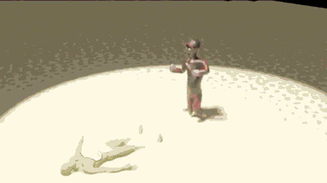 a man in a superhero costume is standing next to a man in a yellow suit laying on the ground .