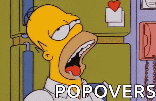 homer simpson from the simpsons is yawning with his mouth open .