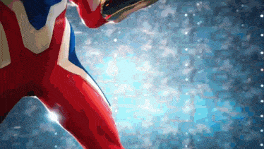 a person in a red white and blue superhero costume is standing in front of a blue background