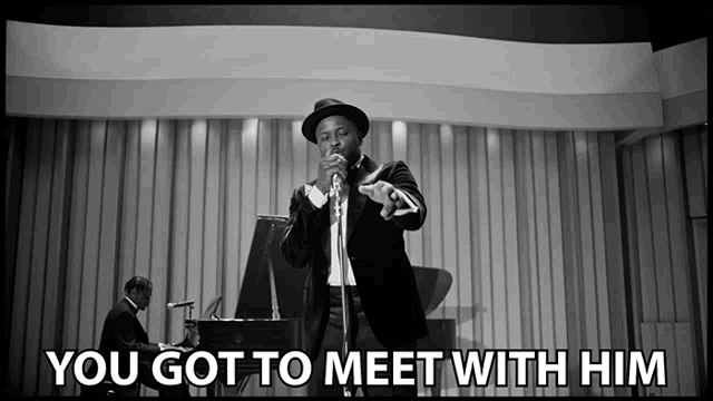 a man singing into a microphone with the words " you got to meet with him " next to him