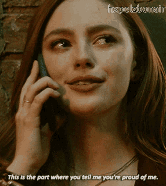 a woman talking on a cell phone with the caption " this is the part where you tell me you 're proud of me