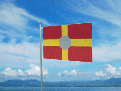 a red and yellow flag is flying in the wind