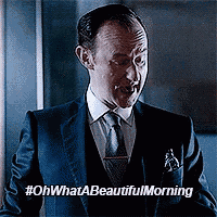 a man in a suit and tie is making a funny face with the words oh what a beautiful morning below him .