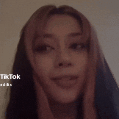 a close up of a woman 's face with the words tiktok ardilix on the bottom