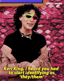 a woman wearing sunglasses and a black shirt says kori king i heard you had to start identifying as they / them