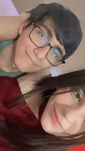 a man and a woman are posing for a picture together