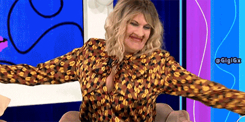 a woman in a leopard print shirt is sitting in a chair with her arms outstretched