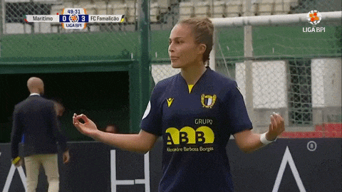 a female soccer player wearing a blue shirt that says grupo a3b