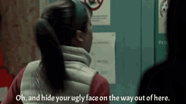 a woman in a white vest says " oh and hide your ugly face on the way out of here "