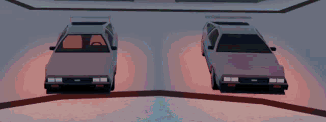 two dmc cars are parked next to each other in a parking garage