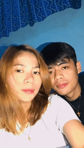 a man and a woman pose for a picture together