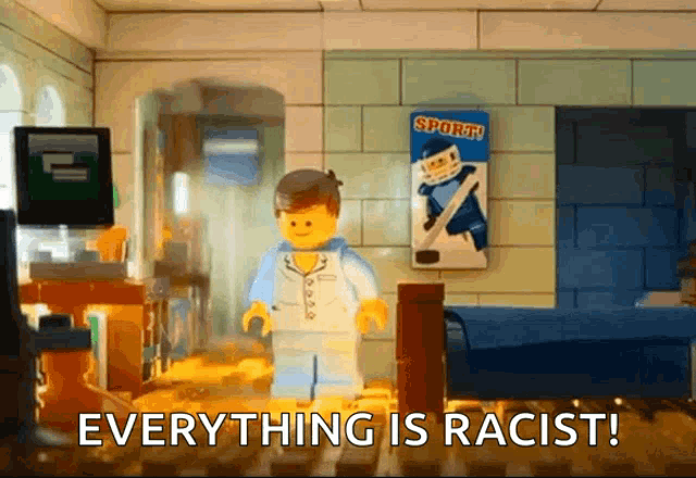 a lego man standing in a room with the words " everything is racist "