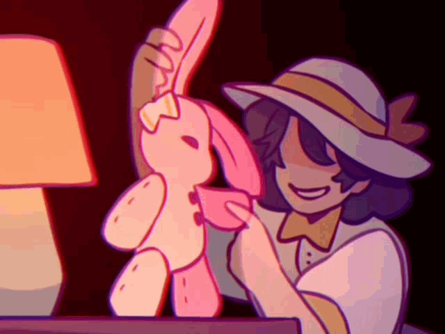 a girl in a hat is holding a pink stuffed bunny rabbit .