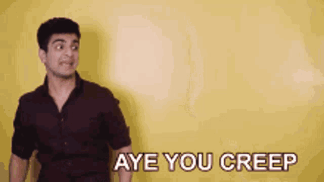a man is screaming with the words aye you creep above him