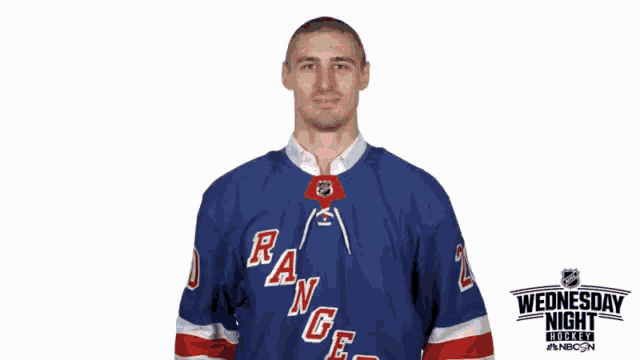 a man wearing a rangers jersey with hearts around his mouth