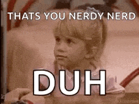 a little girl is sitting at a table with the words `` thats you nerdy nerd duh '' written on it .