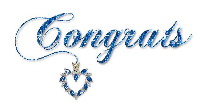 a congratulations sign with a heart shaped necklace