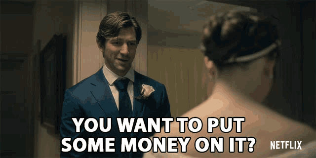 a man in a suit asks a woman if she wants to put some money on her