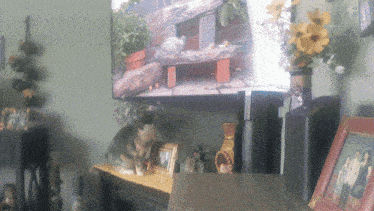 a living room with a picture of a turtle on the wall and a picture of a couple in a frame