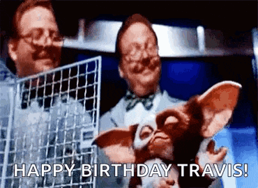 a man is holding a stuffed animal in a cage and says `` happy birthday travis ! ''