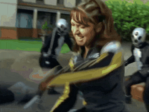 a blurry picture of a woman in a superhero suit