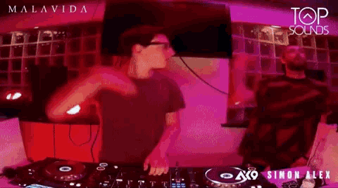 two men are playing music at top sound