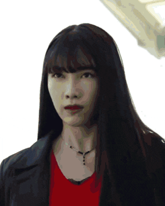 a woman with long black hair and bangs is wearing a red shirt and black jacket