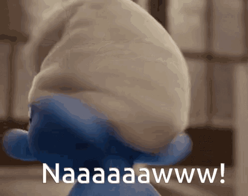 a smurf wearing a white hat with the words naaaaawww written on it