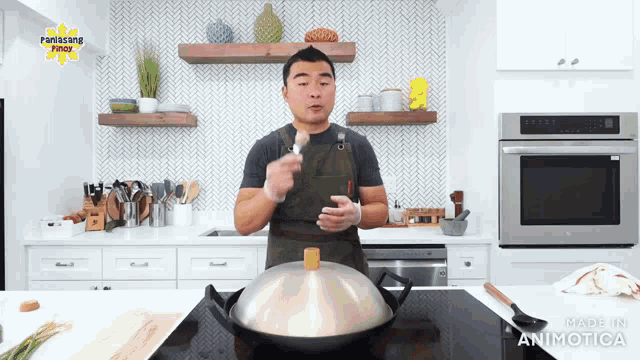 a man cooking in a kitchen with the words made in animatica on the bottom of the screen