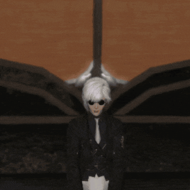 a person with white hair standing in front of a wall