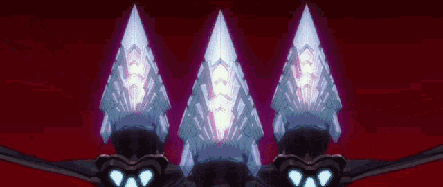 three glowing triangles are sitting on a red surface .
