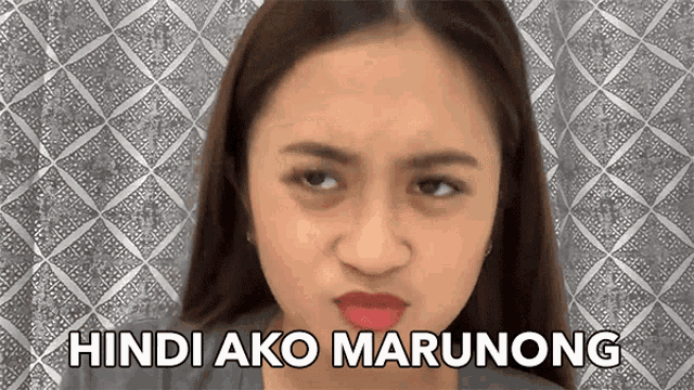 a woman is making a funny face with the words hindi ako marunong written below her