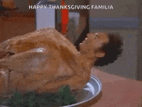 a shirtless man is laying on a plate of food with the words `` hey buddy '' written on it .