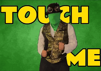 a man with a green face is dancing in front of a green background with the words touch me on it