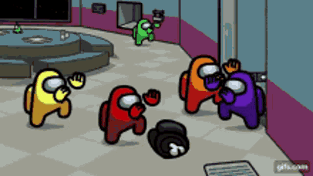 a group of among us characters are standing in a room .
