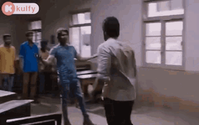 a group of men are standing in a room with their arms outstretched .