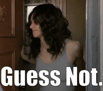 a woman standing in front of a door with the words " guess not " written below her