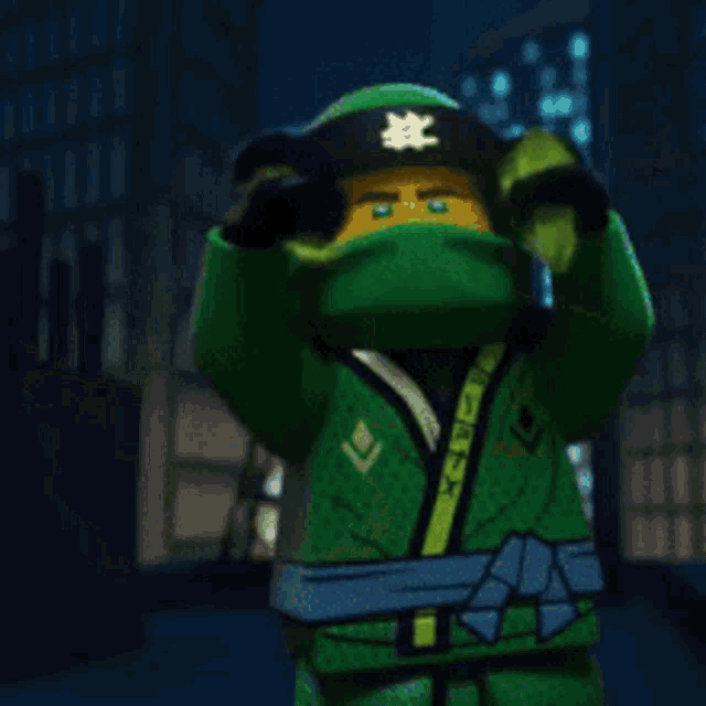 a lego ninjago character with a green helmet and a mask on his face .