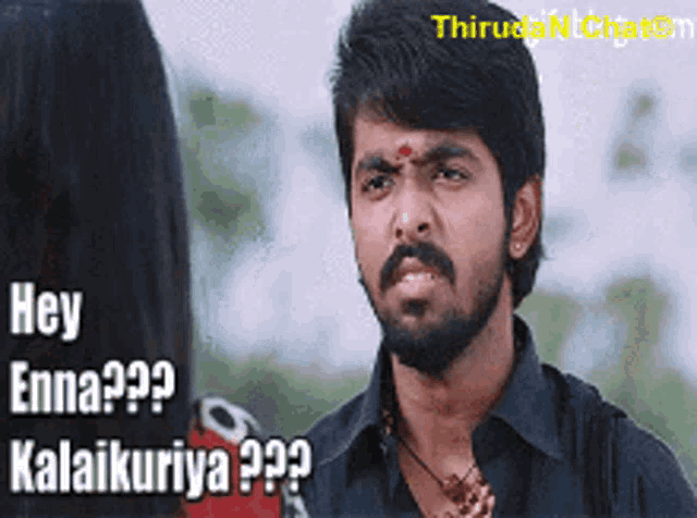 a man with a beard is talking to a woman with the words hey enna kalaikuriya